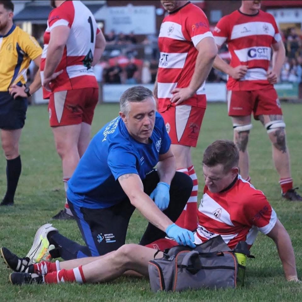 Stuart Sahan providing sports therapy treatment at Nuneaton Old Eds